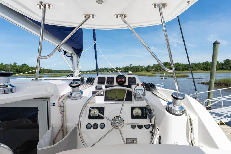 Slide: The Image of 2016 Leopard 44 Owners Version yacht cockpit with clear enclosure and ropes. - 12