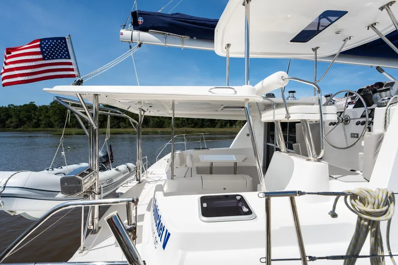 Slide: The Image of 2016 Leopard 44 Owners Version catamaran deck with blue canopy and clear enclosure. - 15