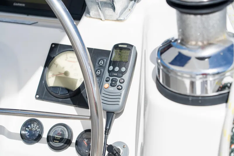 Slide: The Image of 2016 Leopard 44 Owners Version catamaran, featuring sleek design and spacious deck, docked by a serene river. - 18