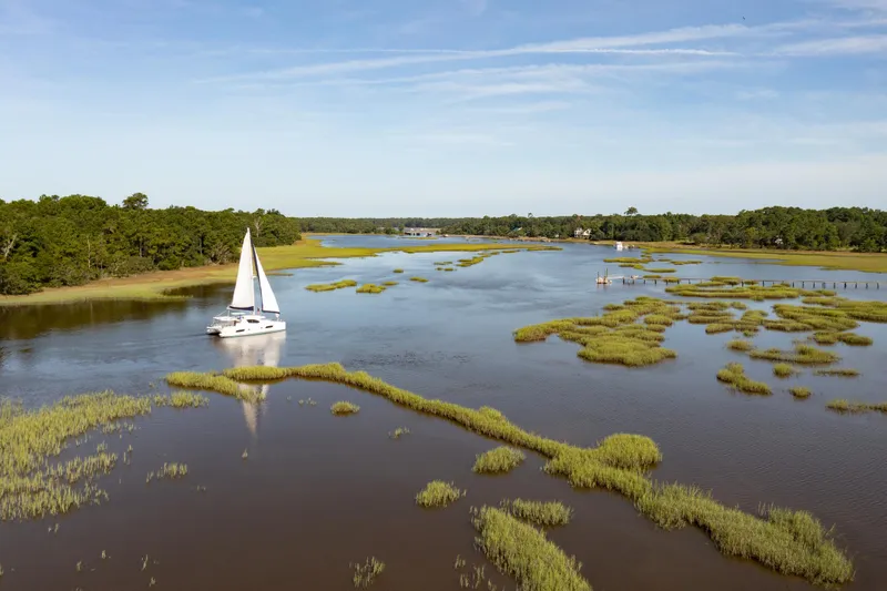 Slide: The Image of Sailboat cruising through serene marshland, Leopard 44 Owners Version, 2016 model. - 2