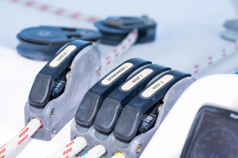 Slide: The Image of Helm of 2016 Leopard 44 Owners Version catamaran with navigational instruments and scenic waterway view. - 20