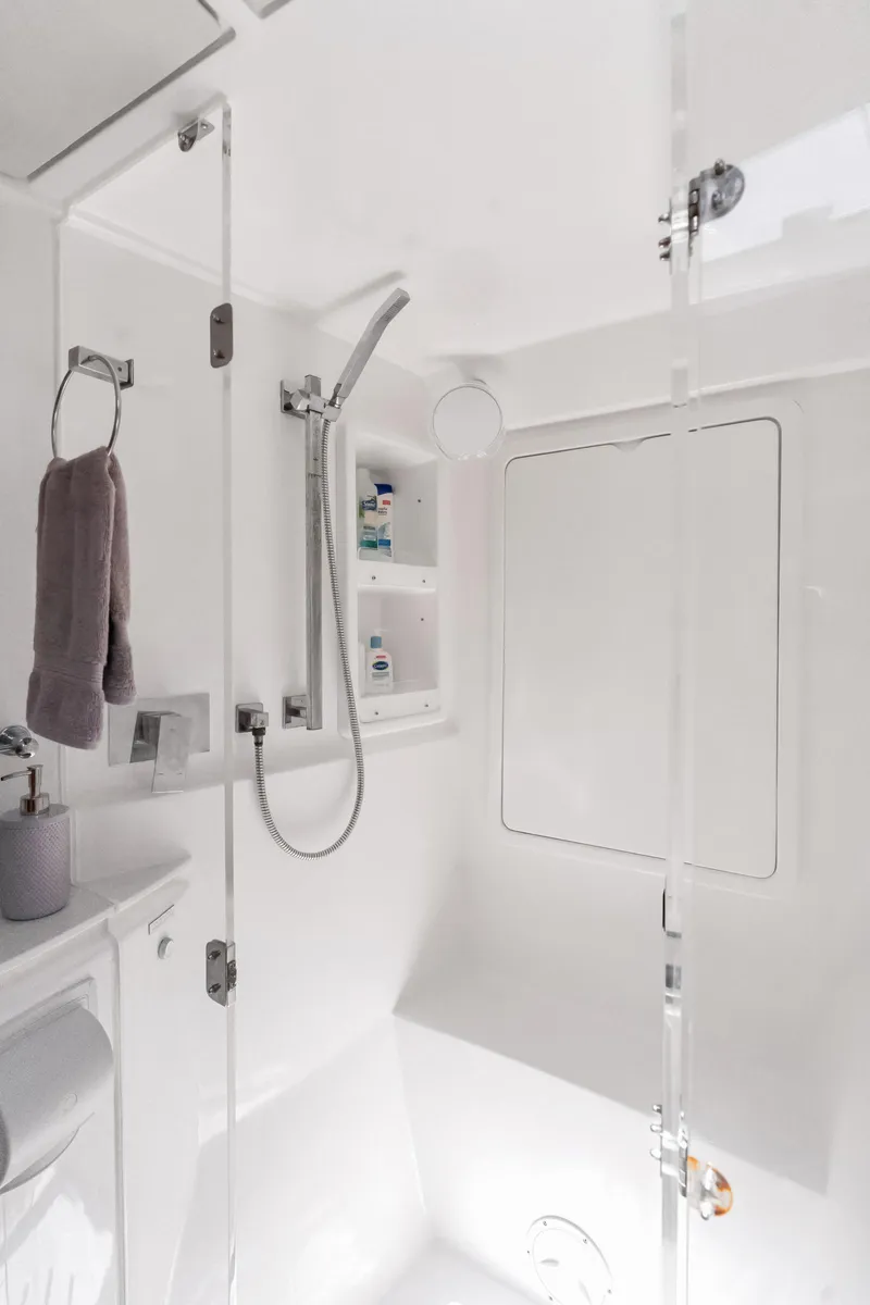 Slide: The Image of 2016 Leopard 44 Owners Version yacht, featuring spacious deck and seating area by the water. - 32