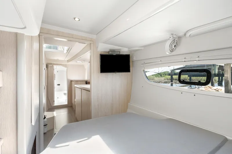 Slide: The Image of 2016 Leopard 44 Owners Version yacht interior with modern kitchen and dining area. - 35