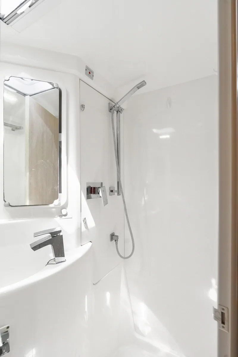 Slide: The Image of Interior of 2016 Leopard 44 Owners Version yacht, featuring a cozy bedroom with blue pillows. - 44