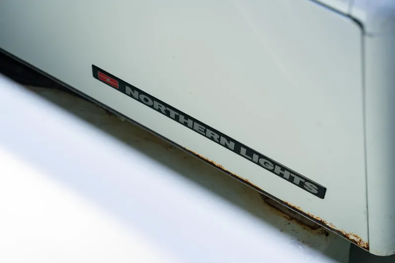 Slide: The Image of Modern bathroom in 2016 Leopard 44 Owners Version yacht, featuring sleek white design and compact fixtures. - 51