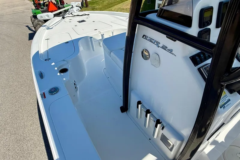 Slide: The Image of 2015 Sea Hunt RZR 24 boat interior with sleek white design and modern features. - 13