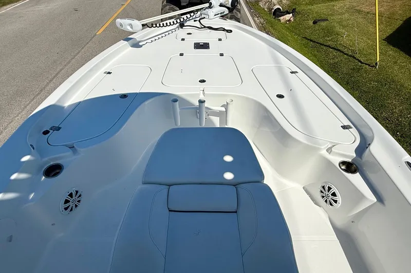 Slide: The Image of 2015 Sea Hunt RZR 24 boat interior with seating and storage compartments. - 14