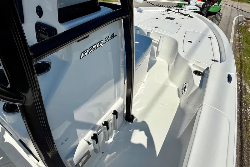 Slide: The Image of 2015 Sea Hunt RZR 24 boat interior with sleek white design and modern features. - 15