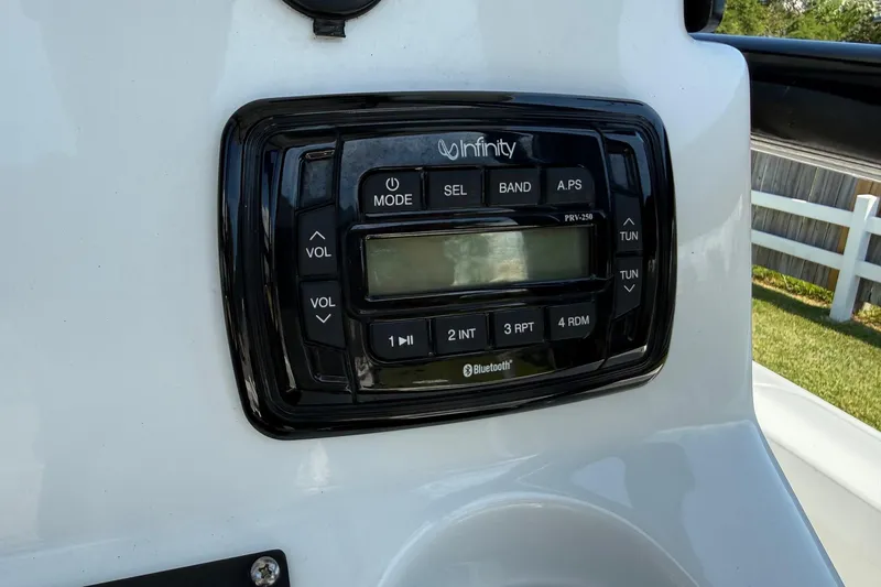 Slide: The Image of Infinity Bluetooth stereo system on 2015 Sea Hunt RZR 24 boat dashboard. - 19