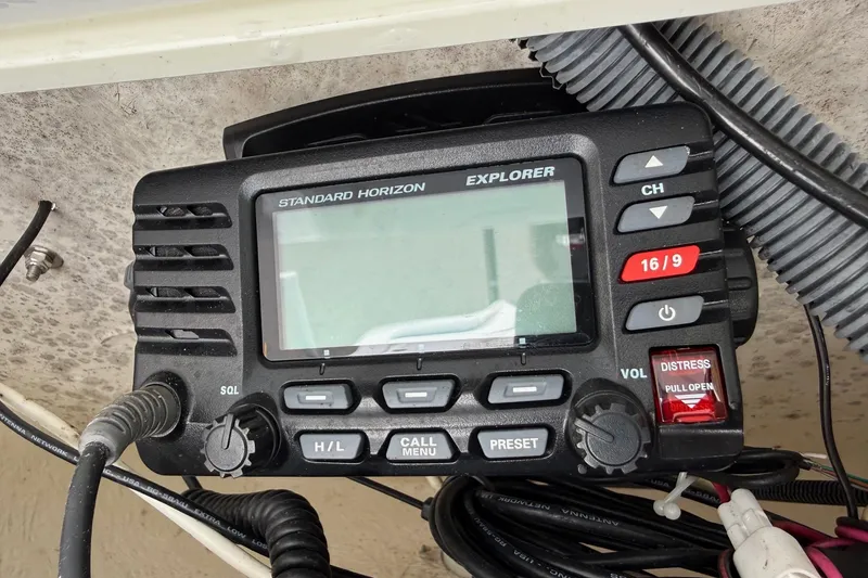 Slide: The Image of Standard Horizon Explorer radio on 2015 Sea Hunt RZR 24 boat dashboard. - 20