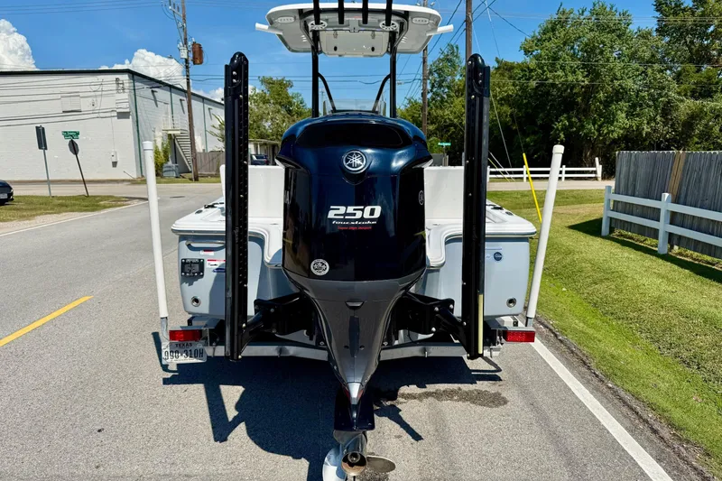 Slide: The Image of 2015 Sea Hunt RZR 24 boat with Yamaha 250 outboard motor on a trailer. - 3