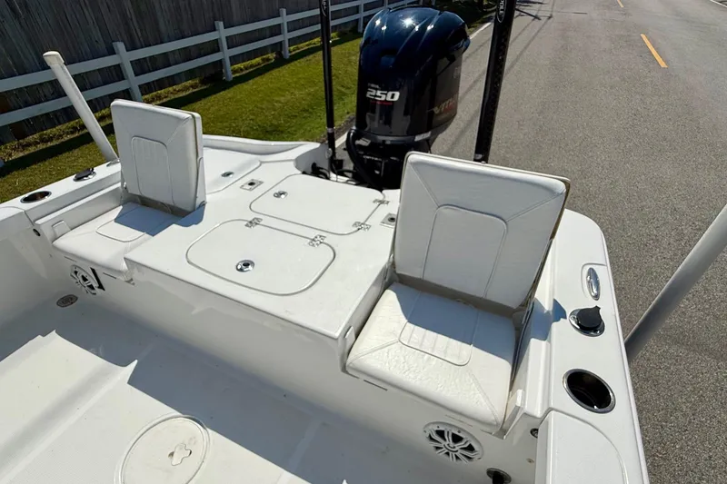 Slide: The Image of 2015 Sea Hunt RZR 24 boat interior with seating and Yamaha 250 engine. - 7