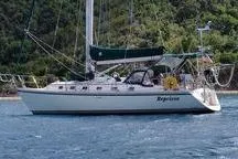 The Image of Sailboat Caliber 40LRC 1999 on water, lush green background, side view. - 0