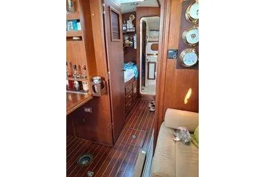 Slide: The Image of Interior of a 1999 Caliber 40LRC yacht with wooden finishes and nautical decor. - 20