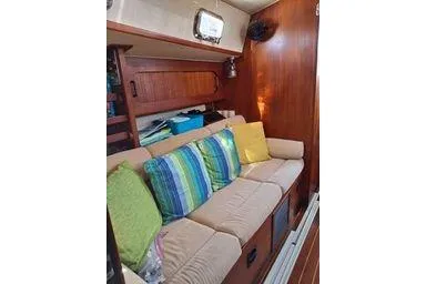 Slide: The Image of Interior of 1999 Caliber 40LRC sailboat with cozy seating and colorful cushions. - 21