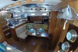 Slide: The Image of Interior of 1999 Caliber 40LRC yacht with dining area and nautical decor. - 25