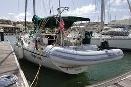 Slide: The Image of Sailboat docked at marina, 1999 Caliber 40LRC with inflatable dinghy. - 3