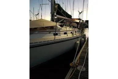 Slide: The Image of Sailboat docked at sunset, 1999 Caliber 40LRC model, side view. - 30