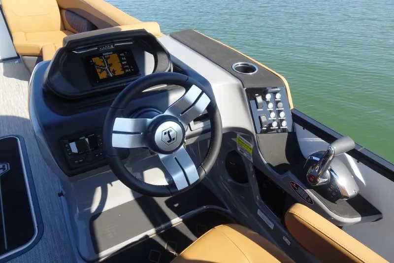 Slide: The Image of Helm of 2026 Harris Sunliner 250 boat with steering wheel and control panel. - 14