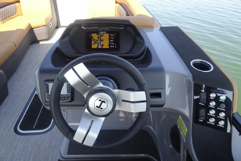 Slide: The Image of Steering console of 2026 Harris Sunliner 250 boat with modern controls and display. - 15