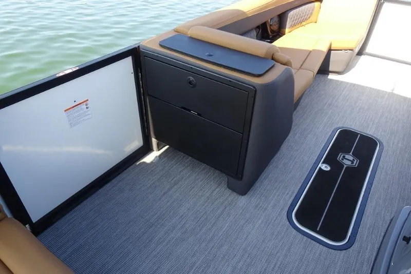 Slide: The Image of Interior of 2026 Harris Sunliner 250 boat with seating and storage compartments. - 18