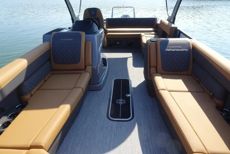 Slide: The Image of Luxurious interior of 2026 Harris Sunliner 250 pontoon boat on calm water. - 25