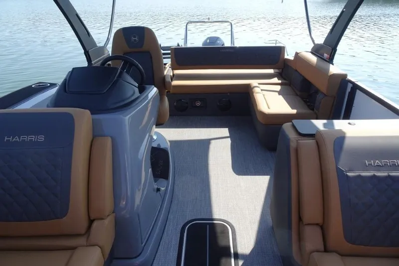 Slide: The Image of 2026 Harris Sunliner 250 boat interior with luxurious seating and modern design. - 26
