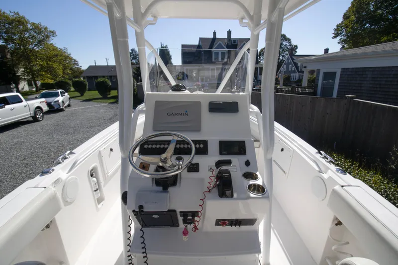 Slide: The Image of 2015 Edgewater 245CC boat console with Garmin navigation system in residential driveway. - 9