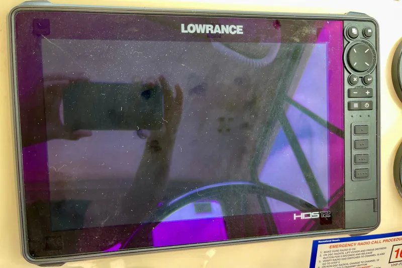 Slide: The Image of Lowrance HDS-12 marine display on 2002 Parker 2520 XL Sport Cabin boat dashboard. - 16