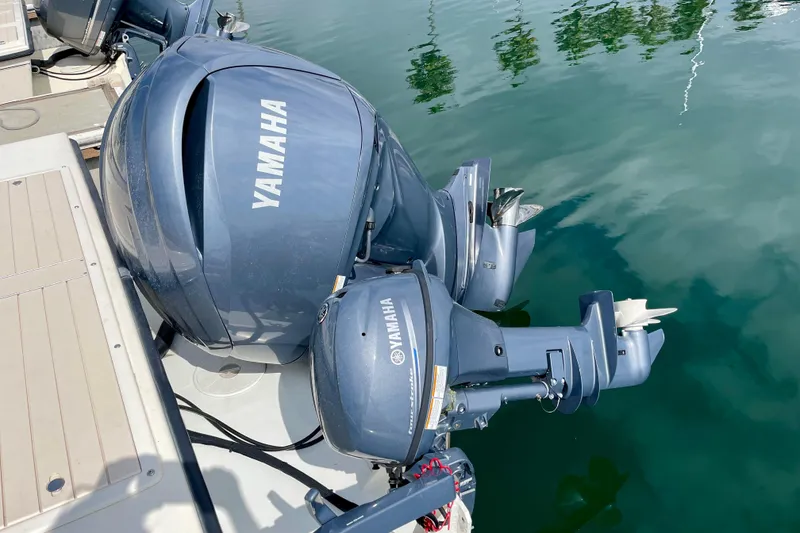 Slide: The Image of Yamaha outboard motors on a 2002 Parker 2520 XL Sport Cabin boat. - 9