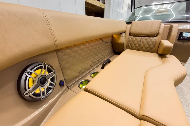 Slide: The Image of Luxurious interior of 2026 Godfrey Sanpan 27' Tritoon with premium seating and speaker system. - 16