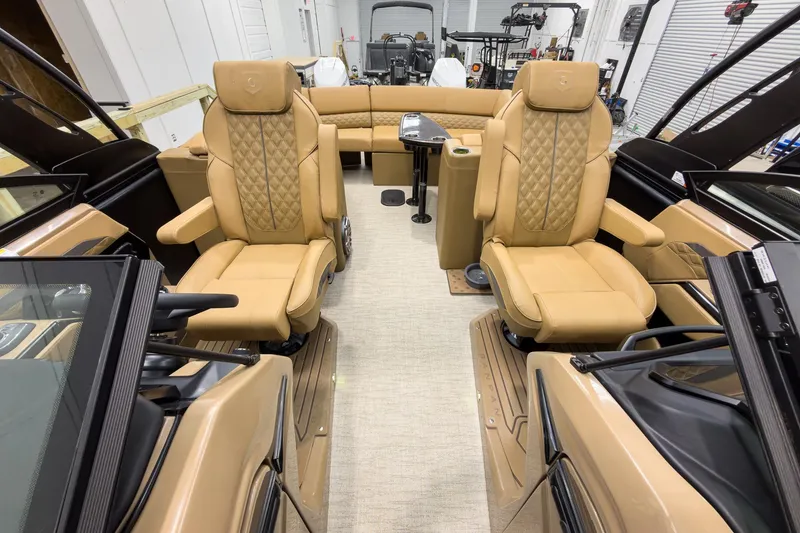 Slide: The Image of Luxurious interior of 2026 Godfrey Sanpan 27' Tritoon with tan leather seating. - 20