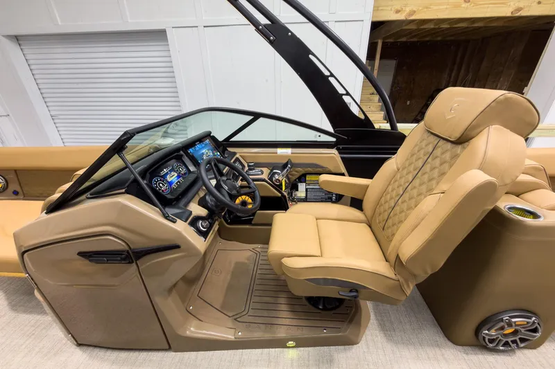 Slide: The Image of Luxurious helm of 2026 Godfrey Sanpan 27' Tritoon with plush seating and advanced controls. - 21