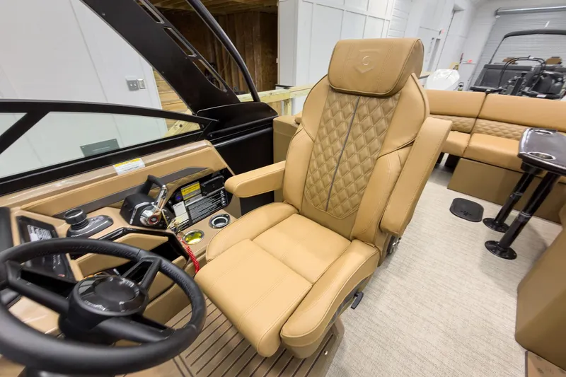 Slide: The Image of Luxurious captain's chair in 2026 Godfrey Sanpan 27' Tritoon boat interior. - 22