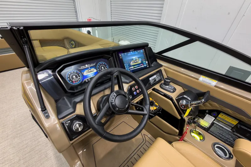 Slide: The Image of Interior view of 2026 Godfrey Sanpan 27' Tritoon dashboard with modern controls and displays. - 24