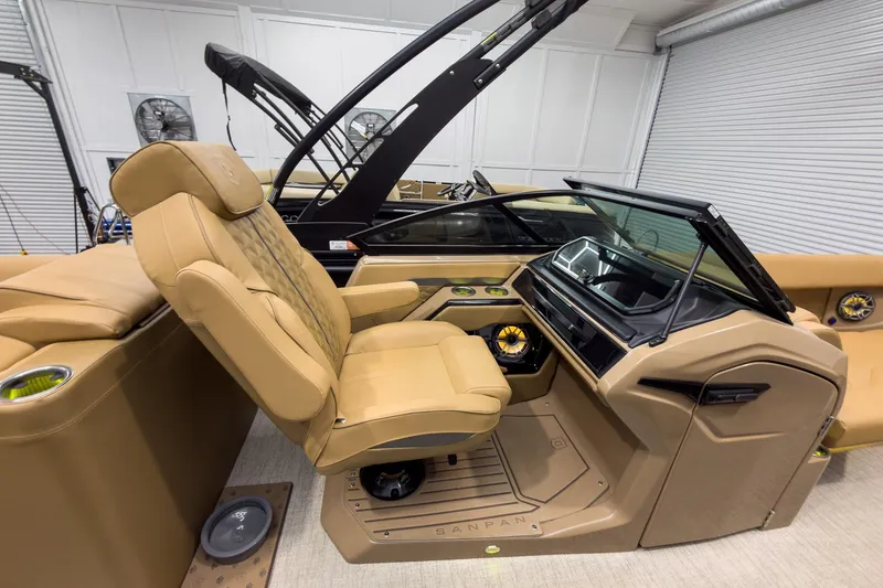 Slide: The Image of Luxurious interior of 2026 Godfrey Sanpan 27' Tritoon with plush seating and modern dashboard. - 28