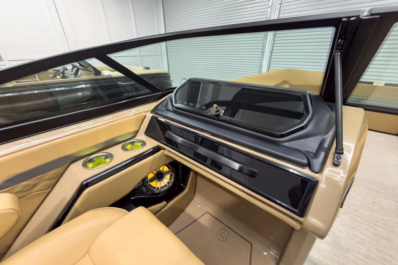 Slide: The Image of Interior of 2026 Godfrey Sanpan 27' Tritoon, featuring modern dashboard and luxurious seating. - 29