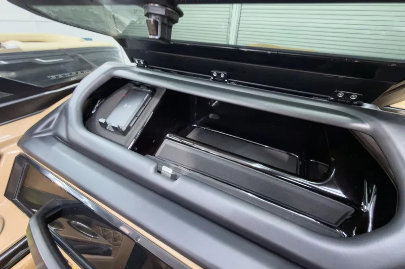 Slide: The Image of Storage compartment of 2026 Godfrey Sanpan 27' Tritoon boat, open and empty. - 30