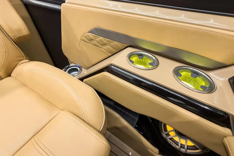 Slide: The Image of Luxurious tan seating with illuminated cup holders in 2026 Godfrey Sanpan 27' Tritoon. - 31