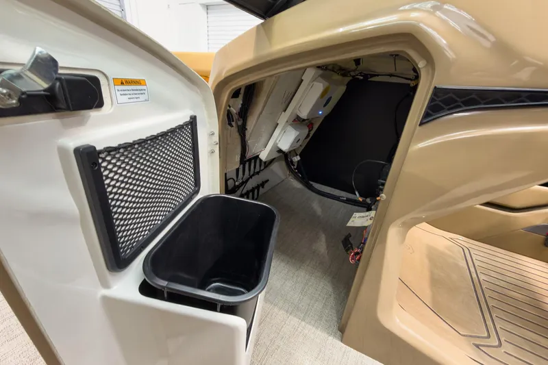 Slide: The Image of Interior view of 2026 Godfrey Sanpan 27' Tritoon, featuring storage and wiring access. - 33