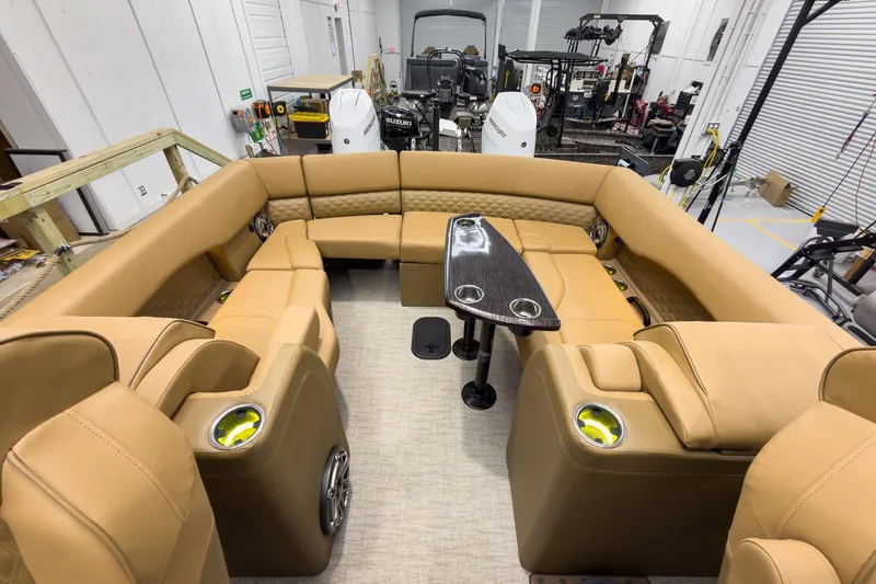 Slide: The Image of Luxurious interior of 2026 Godfrey Sanpan 27' Tritoon with tan seating and sleek table. - 36