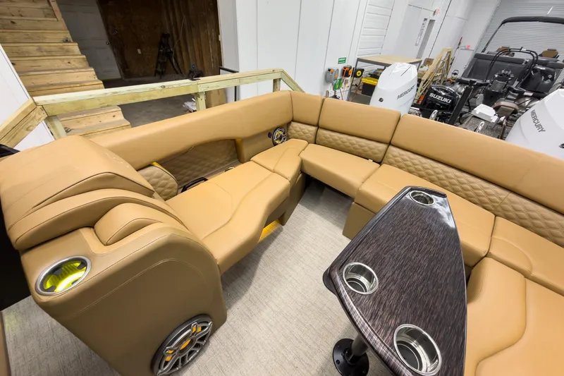 Slide: The Image of Luxurious interior of 2026 Godfrey Sanpan 27' Tritoon with plush seating and table. - 38