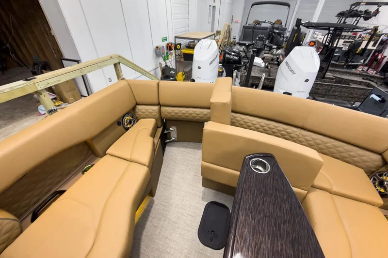 Slide: The Image of Luxurious interior of 2026 Godfrey Sanpan 27' Tritoon with tan seating and modern design. - 39