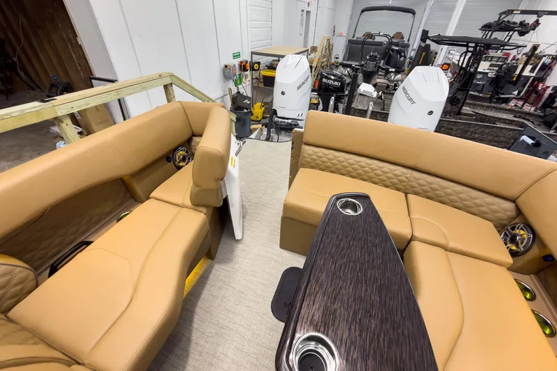 Slide: The Image of Luxurious interior of 2026 Godfrey Sanpan 27' Tritoon with tan seating and modern amenities. - 41