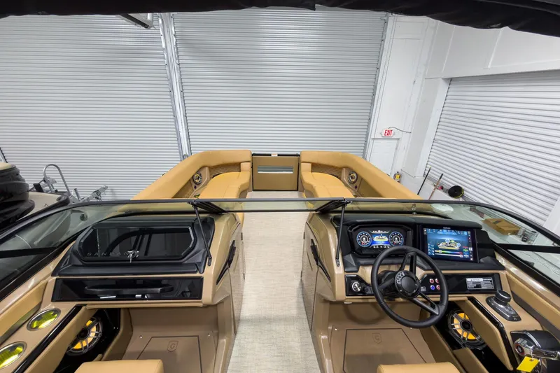 Slide: The Image of 2026 Godfrey Sanpan 27' Tritoon interior with modern dashboard and luxurious seating. - 47