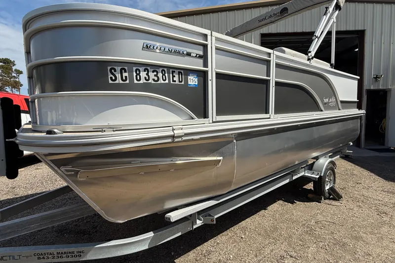 Slide: The Image of 2023 G3 BOATS Select 18F interior with white seating and steering console. - 2