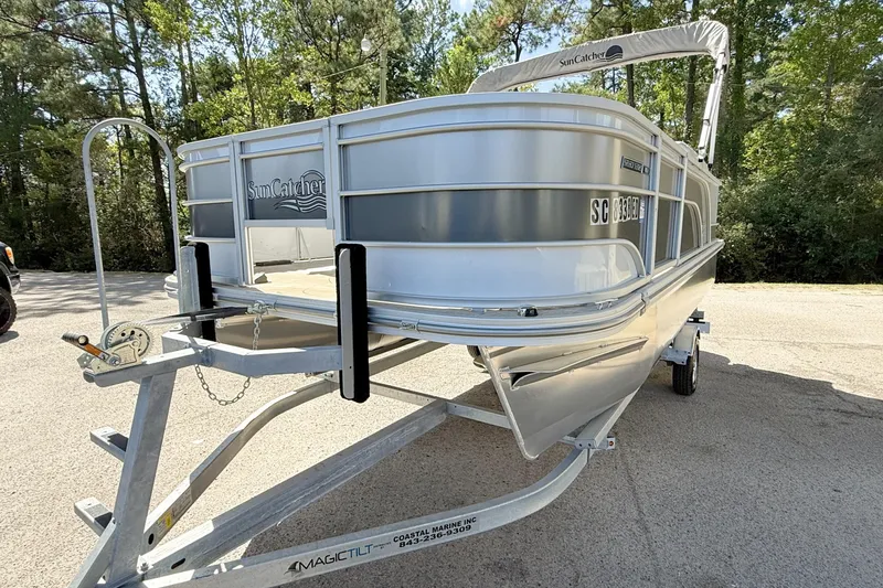 Slide: The Image of 2023 G3 BOATS Select 18F dashboard with steering wheel, gauges, and navigation system. - 3