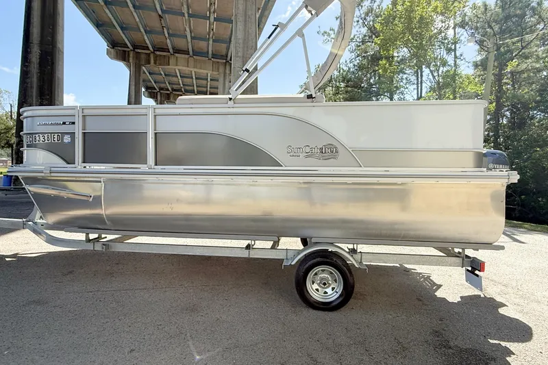 Slide: The Image of 2023 G3 BOATS Select 18F pontoon with Yamaha motor, parked under a bridge. - 6