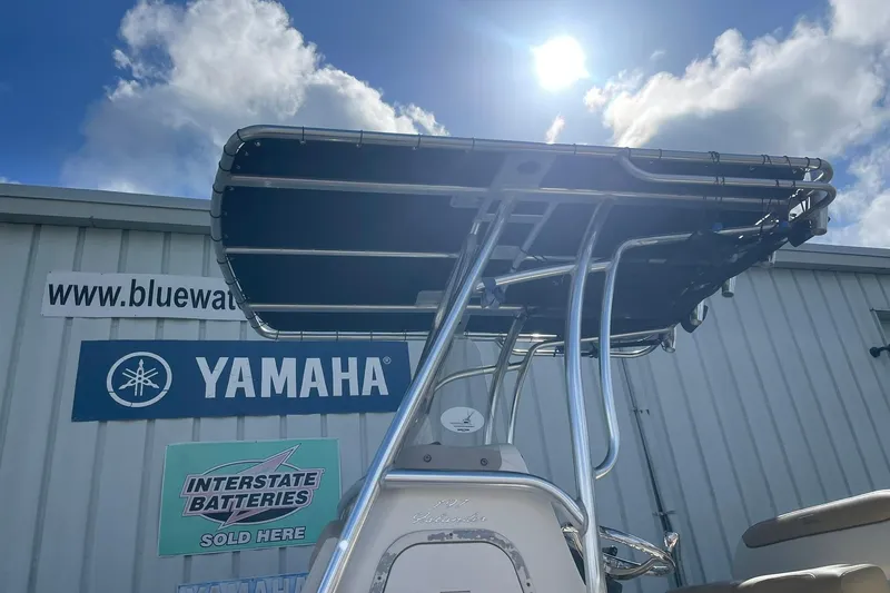 Slide: The Image of 2014 Pioneer 197 Islander boat with T-top, Yamaha and Interstate Batteries signage. - 10