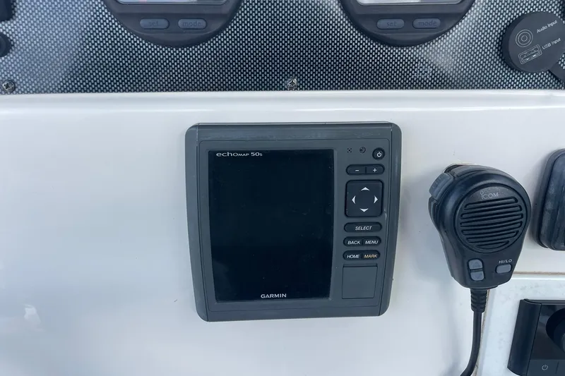 Slide: The Image of Garmin echoMAP 50s and ICOM radio on 2014 Pioneer 197 Islander boat dashboard. - 17